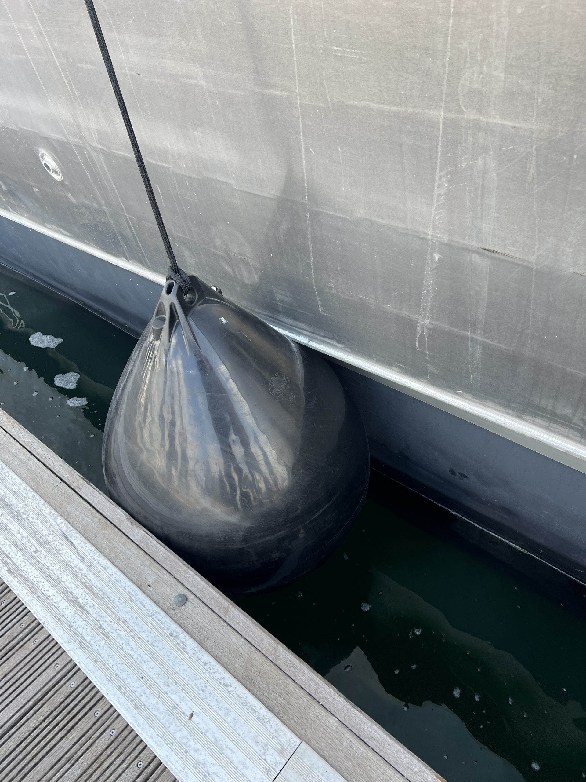 Polyform A series black buoy used as a boat fender southampton boat show