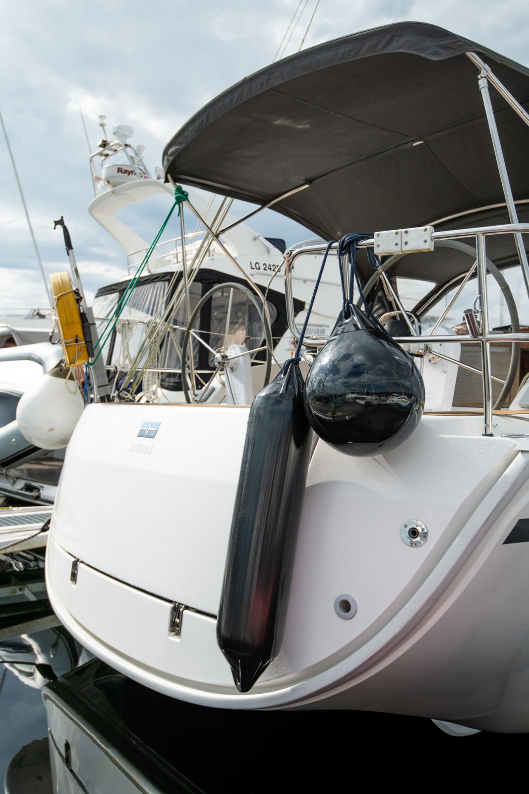 All black polyform fenders f-series on the back of a boat